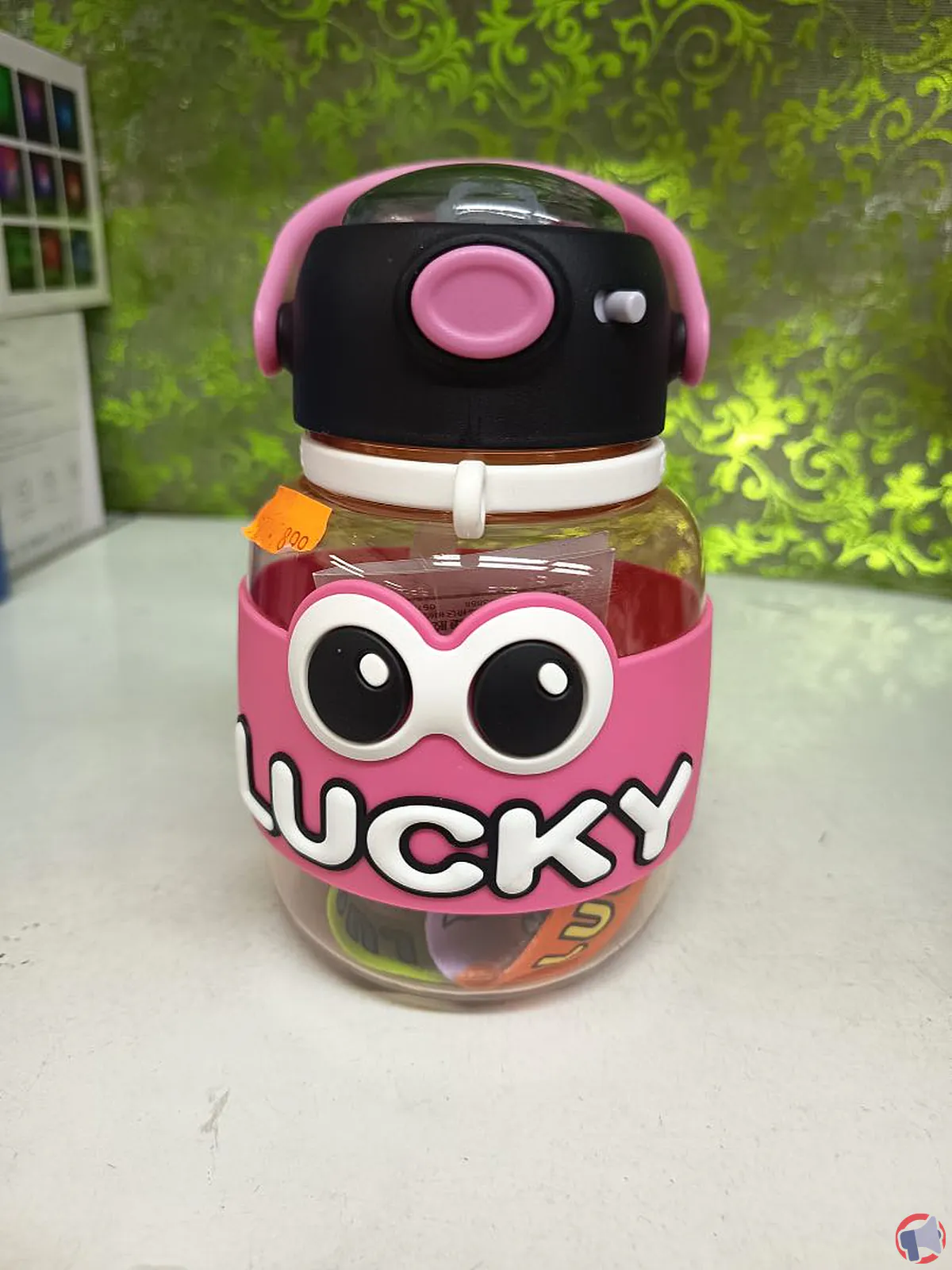 Rappel gourde lucky : cordon trop long, risque de strangulation